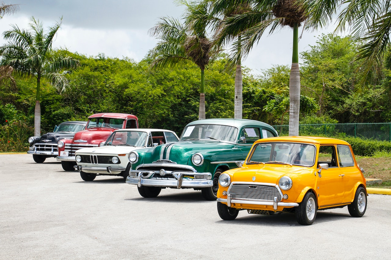 five vintage cars